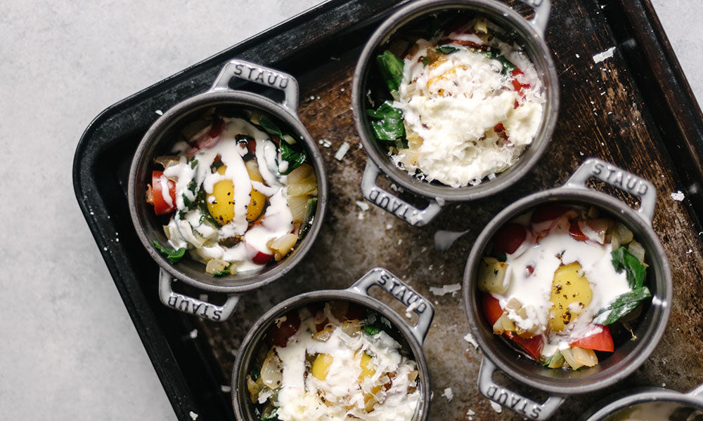 Baked Eggs with Ramps, Sweet Onions, Tomatoes & Goat Cheese Vermont