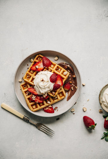 Waffles Topped with Vanilla Crème Fraîche and Strawberries